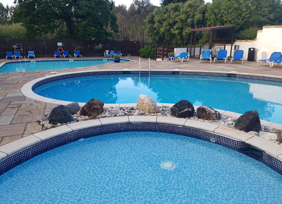 Outdoor pool with paved surround