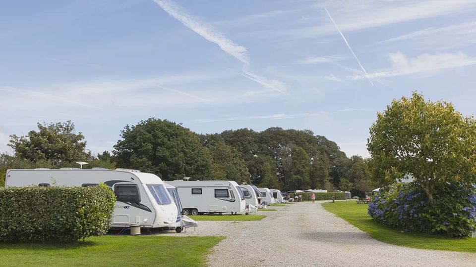 Caravan pitches along gravel road