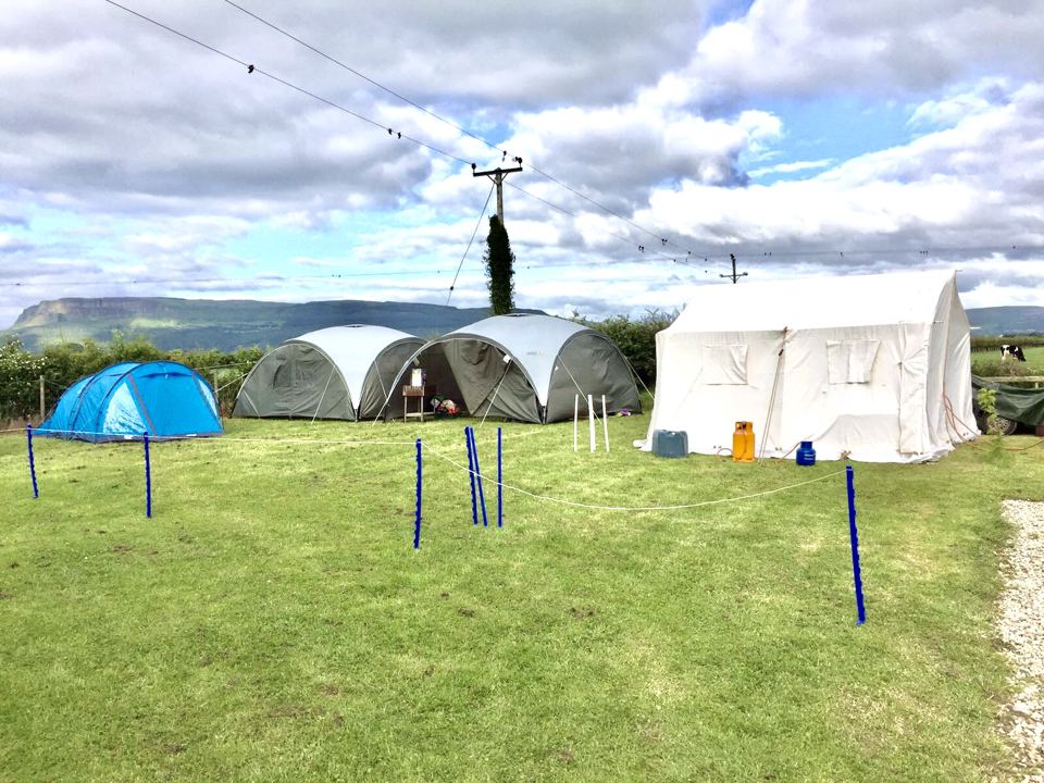 Tents with Binevenagh behind