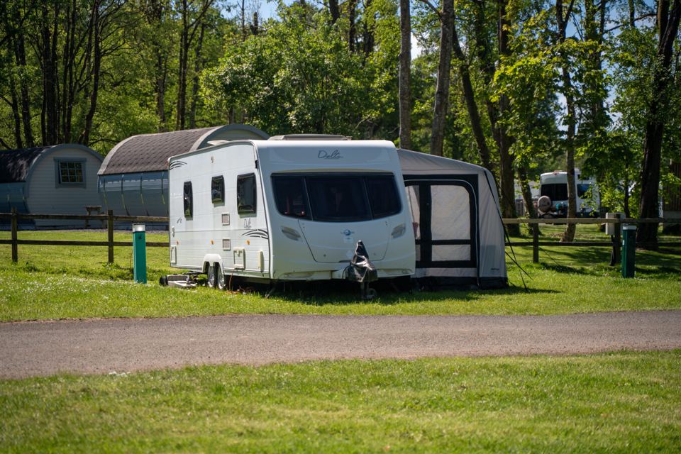 Caravan with awning on grass