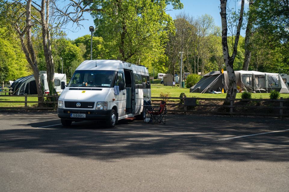 Campervan beside tents