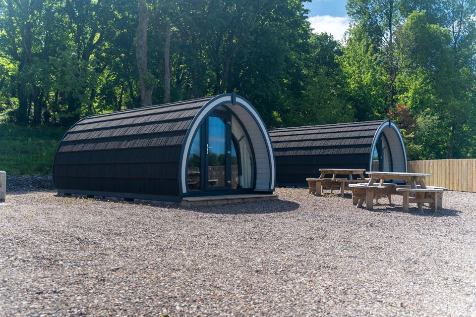 Glamping pods with picnic tables