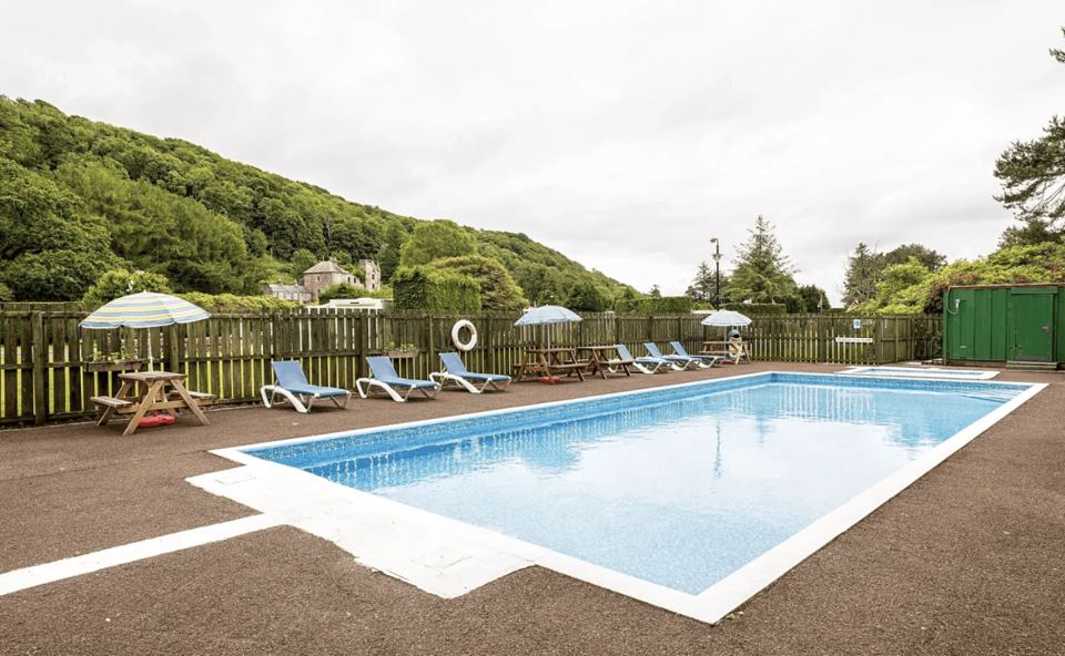 Outdoor pool with sun loungers
