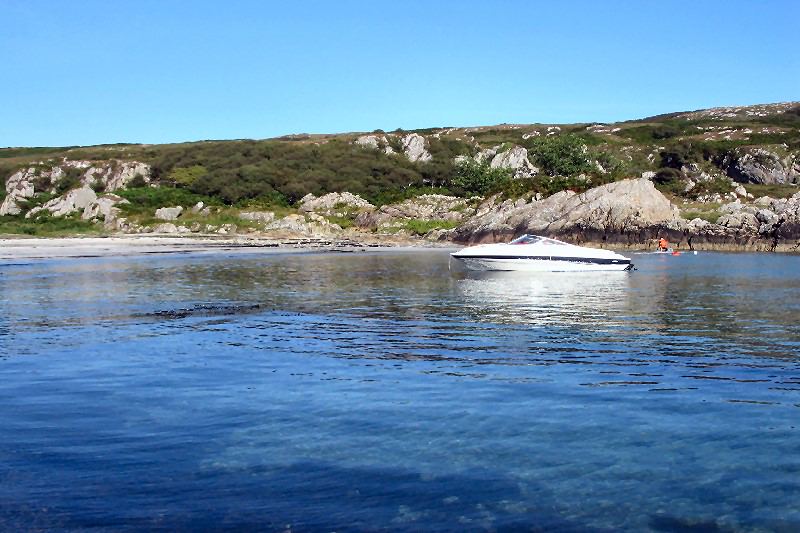 Boat in a rocky bay