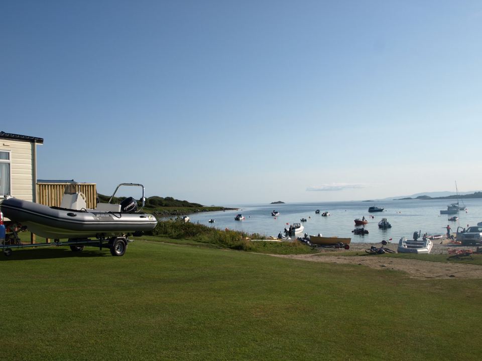 Boat on a trailer by the shore