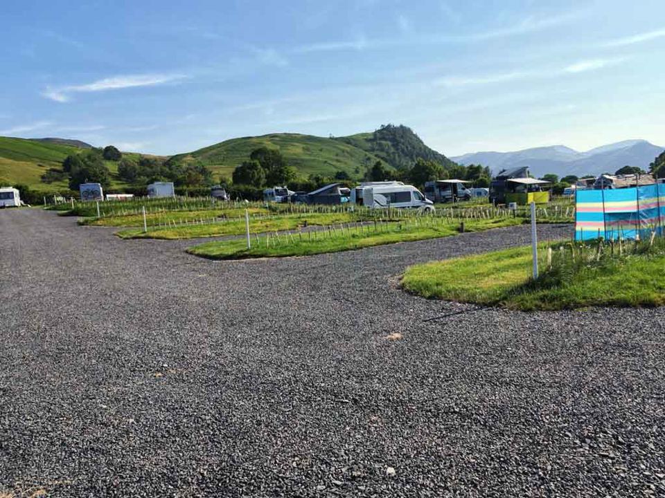 Gravel pitches with a view of the hill