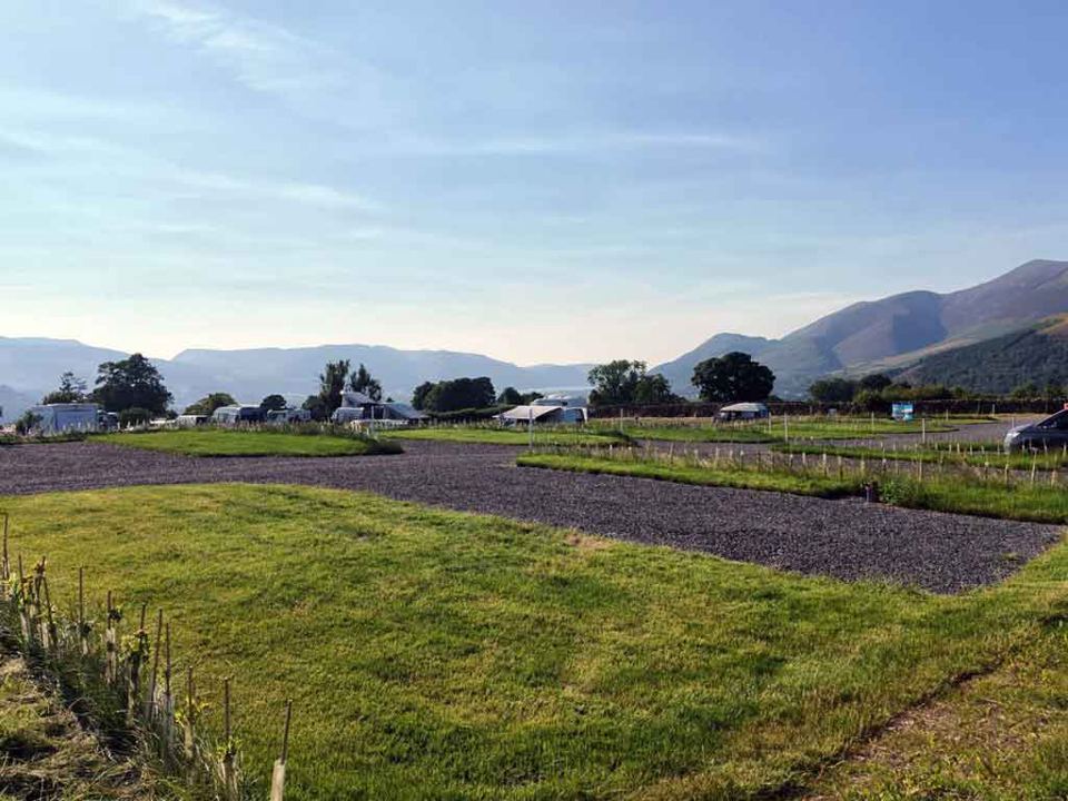 Grass field with mountains beyond