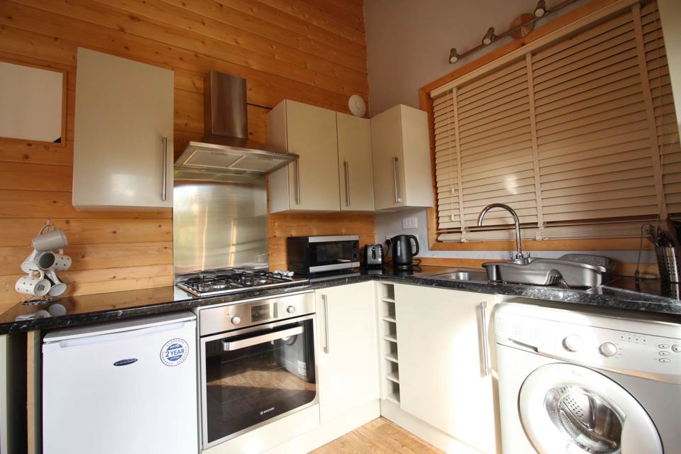Wood-lined lodge kitchen
