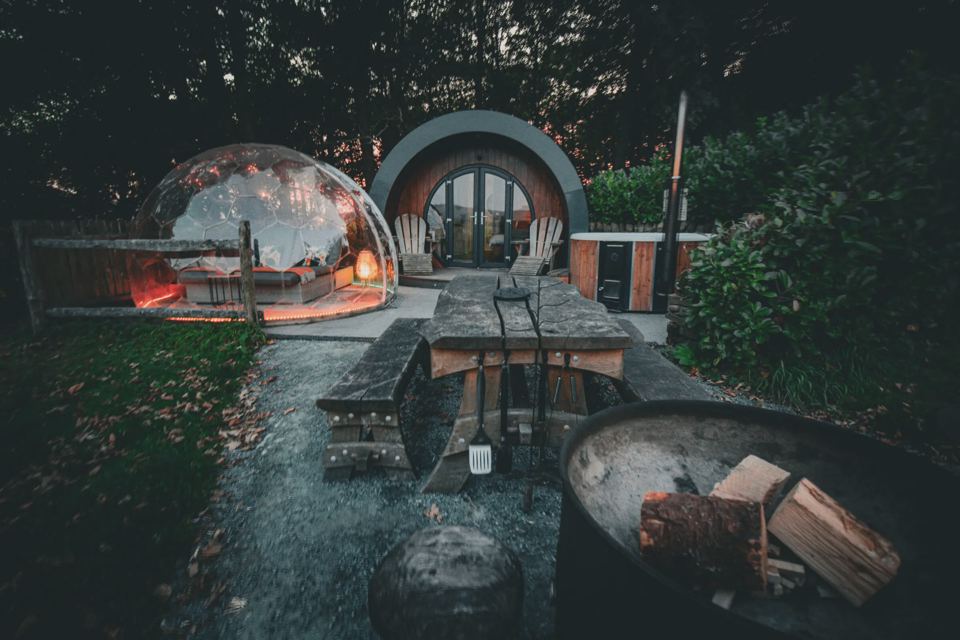 Pods with fire pit at dusk