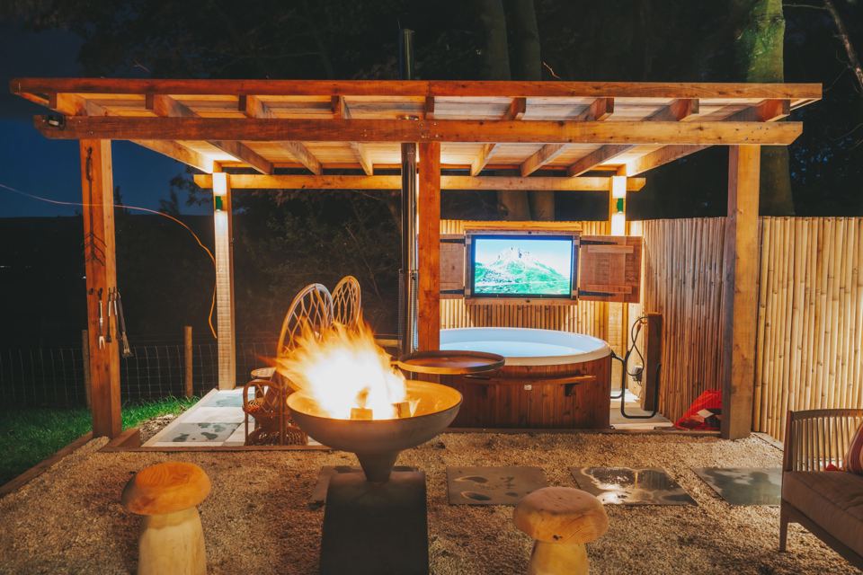 Hot tub and fire bowl at night