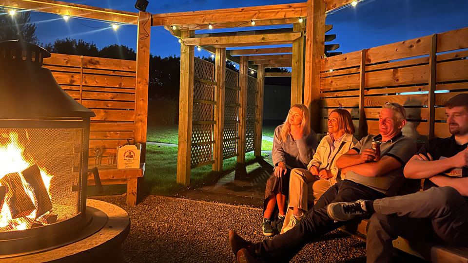 Covered fire pit area at night
