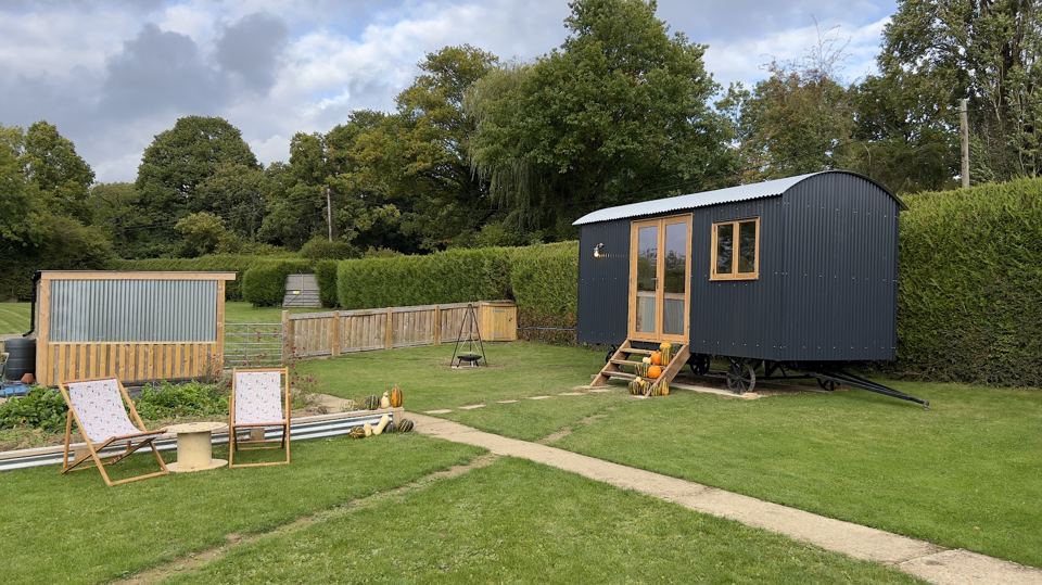 Shepherd's hut and fire pit area