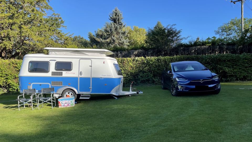 Small caravan on a hedged pitch