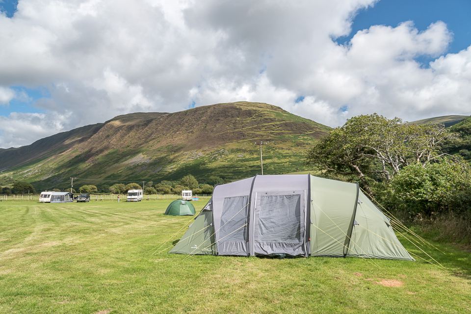 Tent pitched below the hills