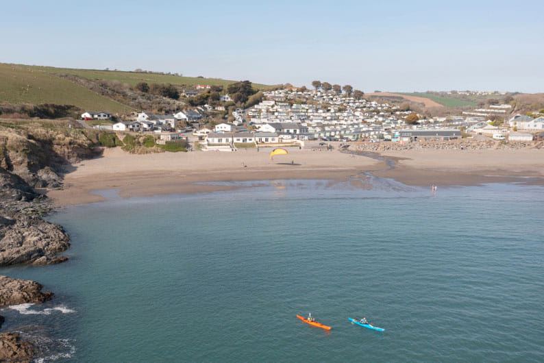 Beach and bay with kayaks