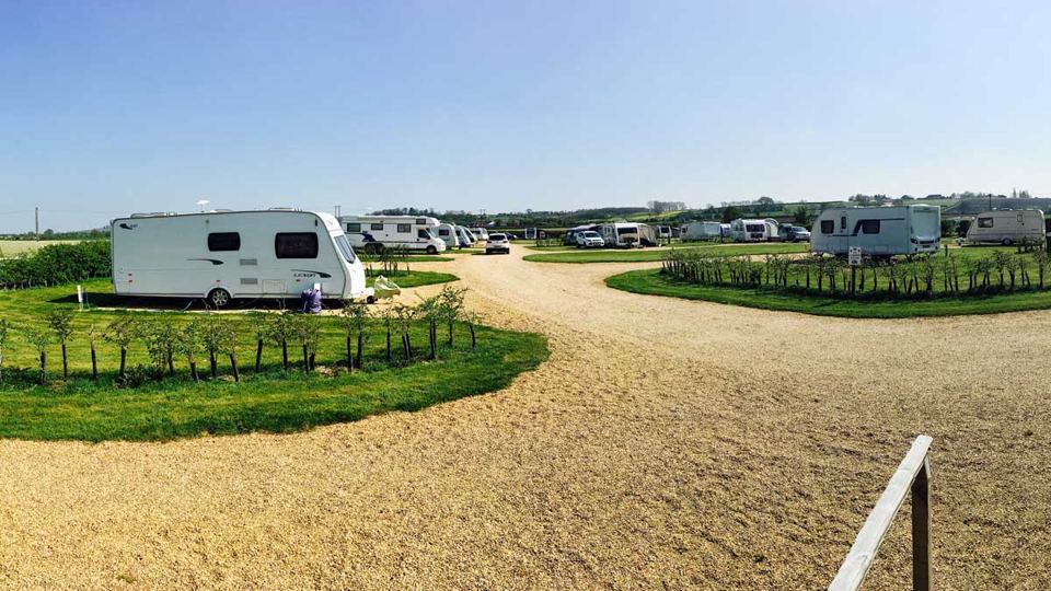Open grass pitches with gravel track