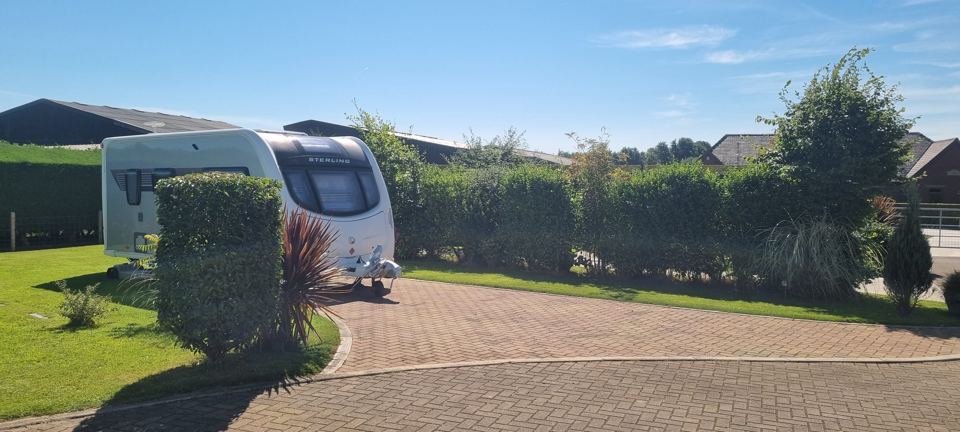 Caravan on a paved pitch