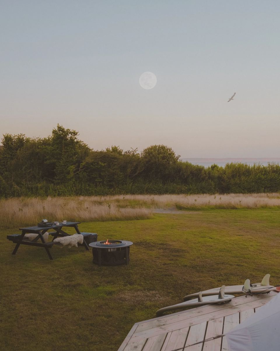 Fire pit and picnic table at dusk