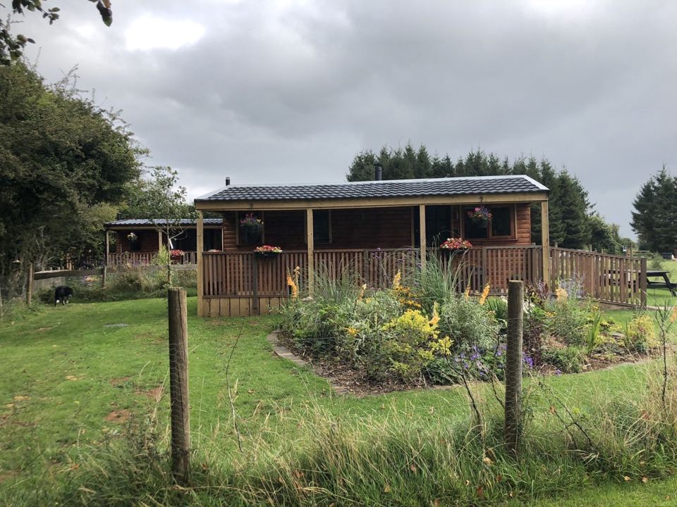Lodge in its fenced garden