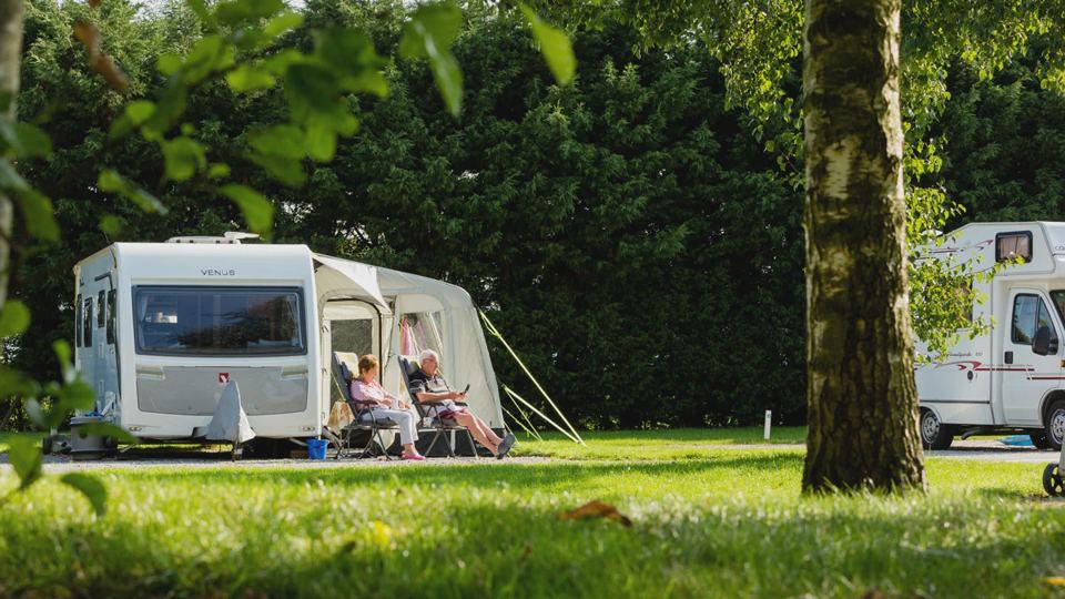 Caravan and awning on grass