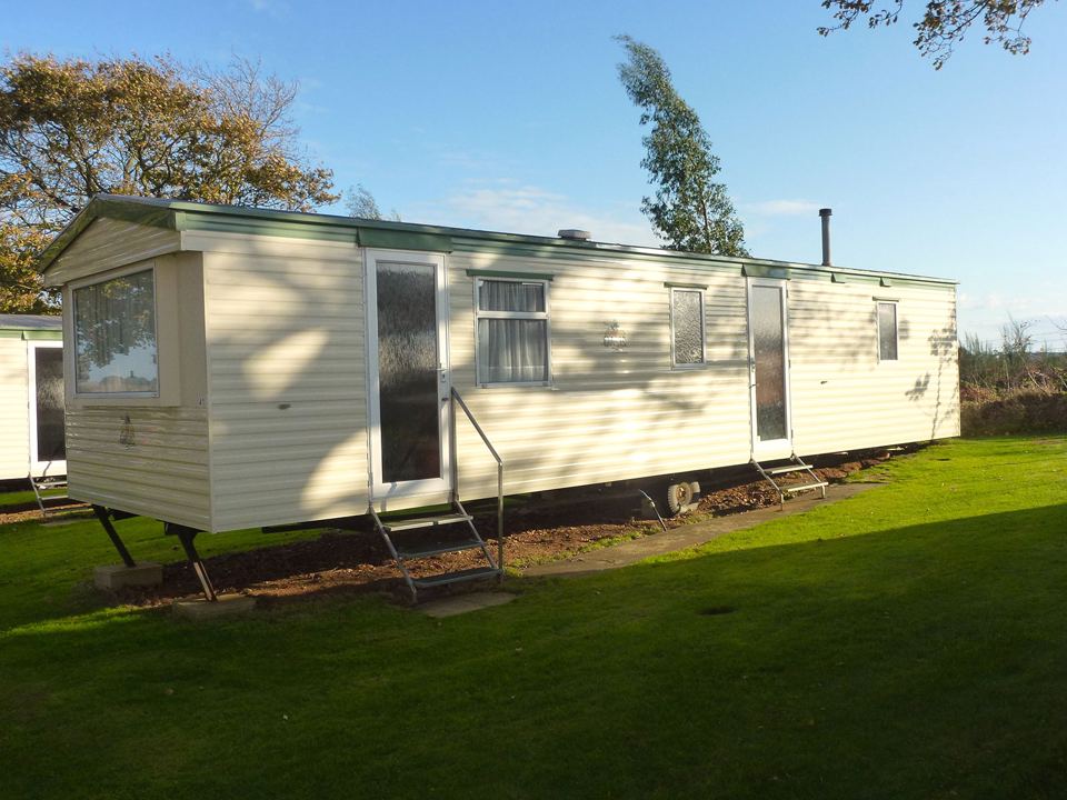 Surrey caravan beside the field