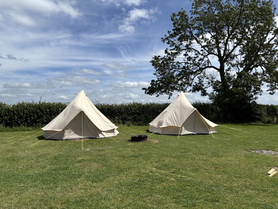 Two bell tents in the field