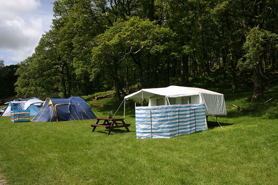 Tent with awning and picnic bench