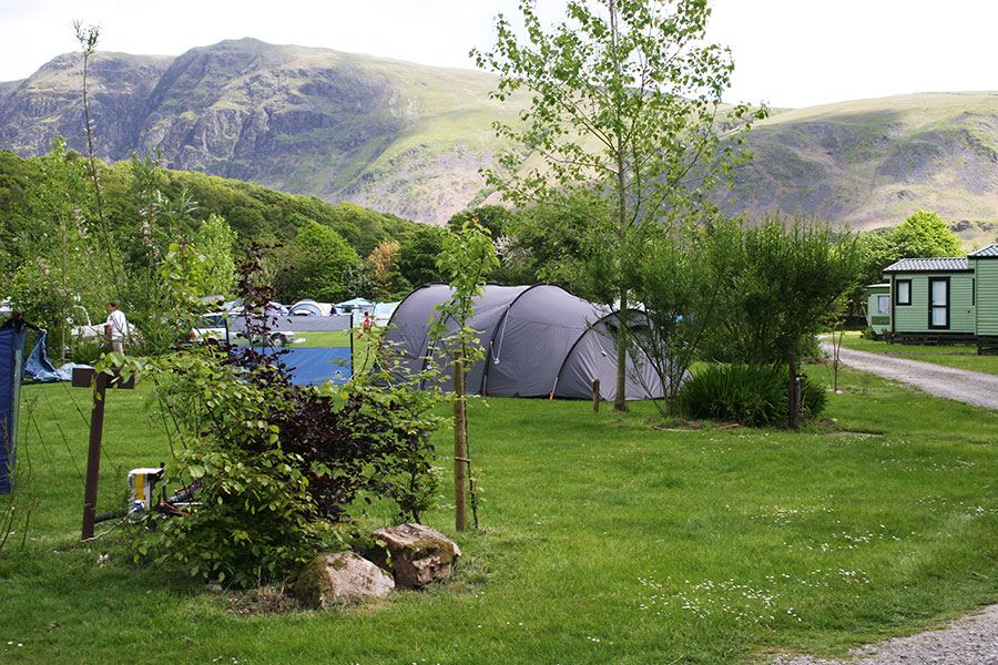 Tent in the field with hills