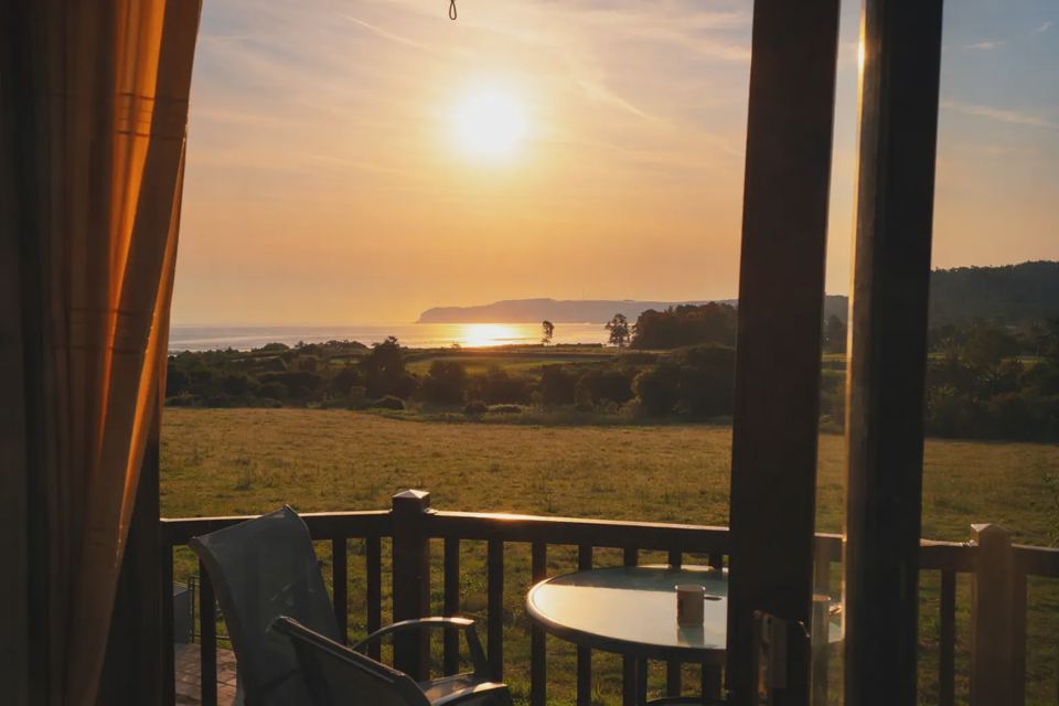 Sunset over the bay from a balcony