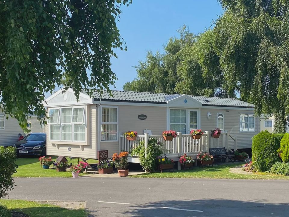 Caravan with flower borders