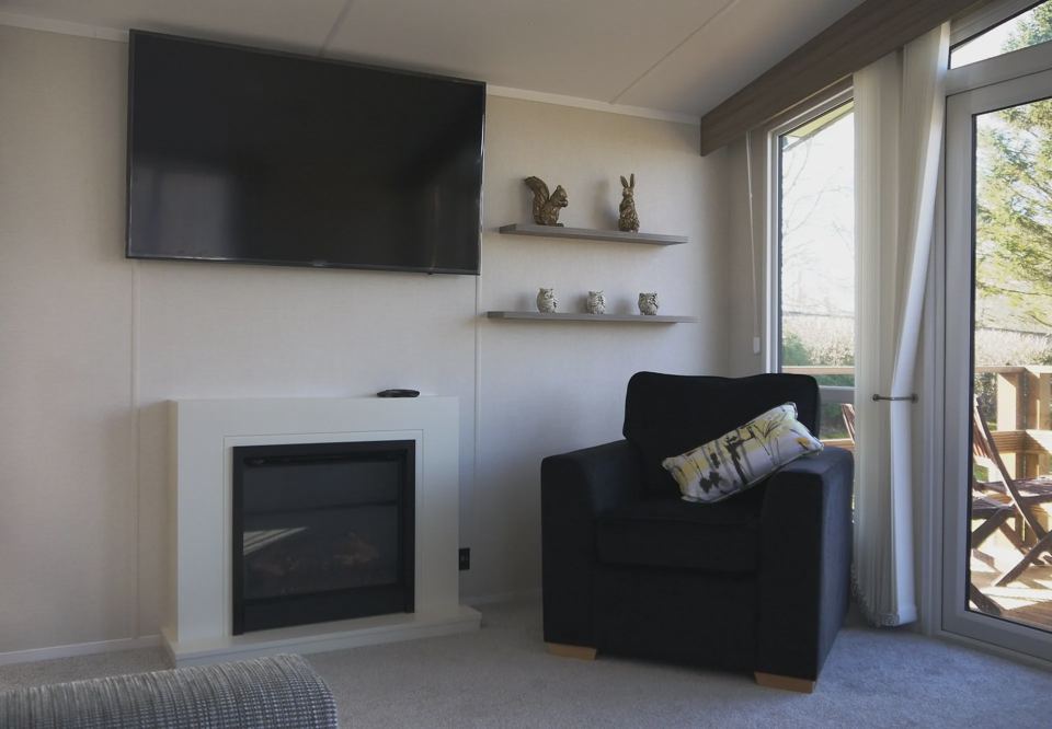 Lounge with fireplace and armchair