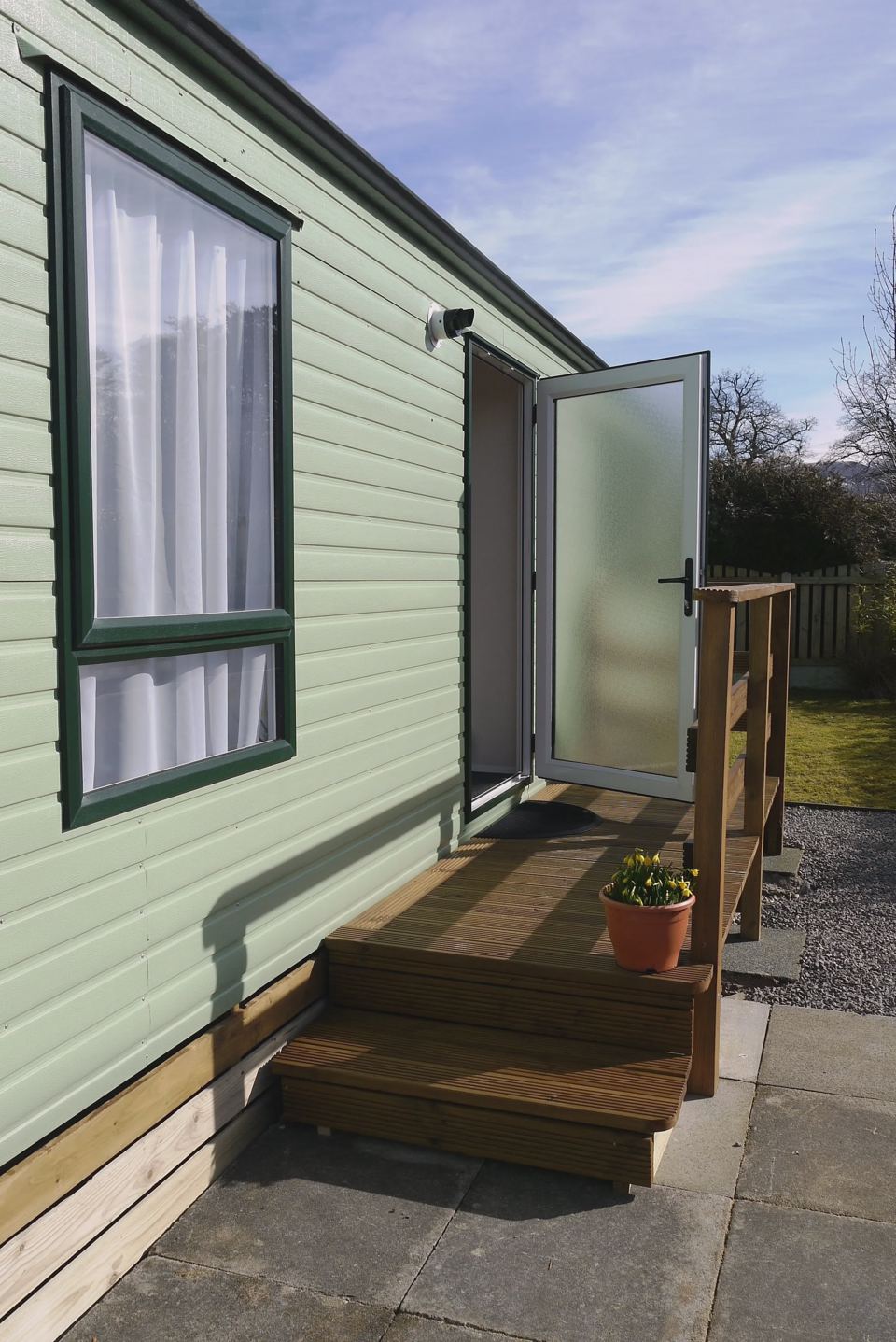 Caravan doorway with decking steps