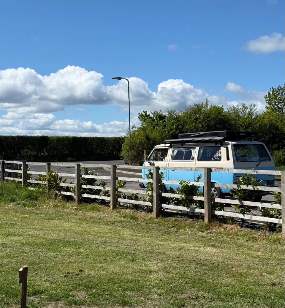 Campervan beside the fence