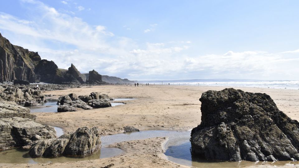 Beach with rock pools at low tide