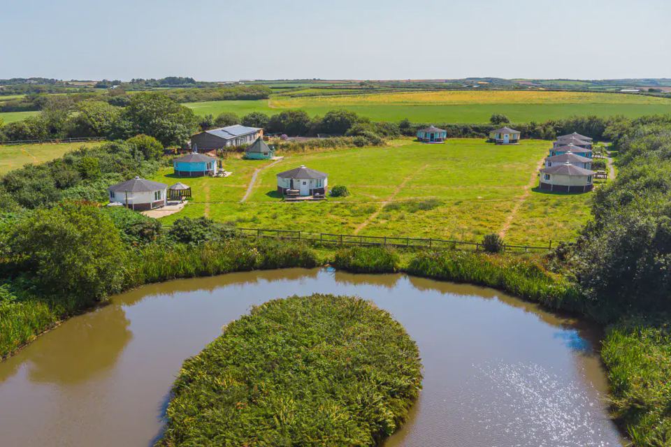 Aerial view of cabins around the pond