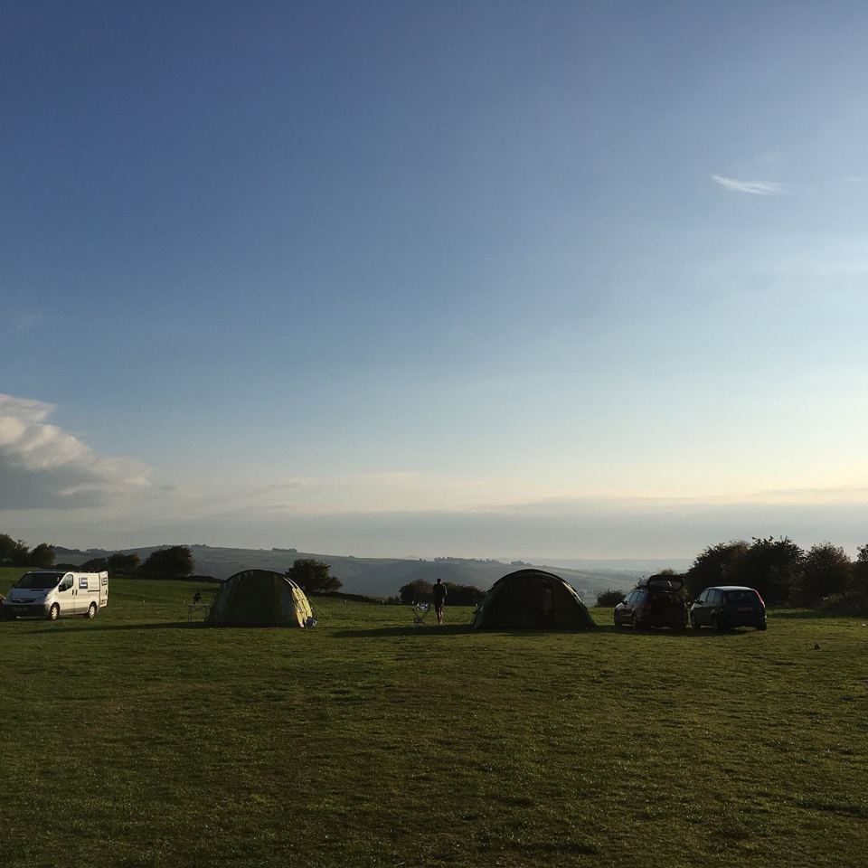 Tents in the field at dusk