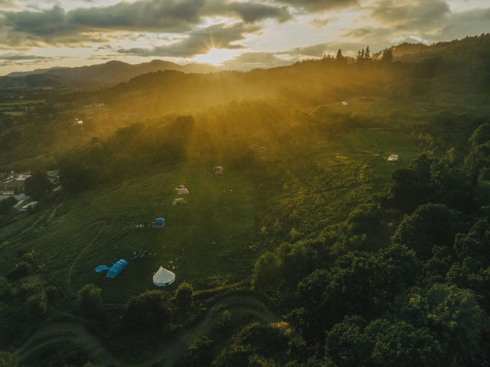 Woods and camps at sunset