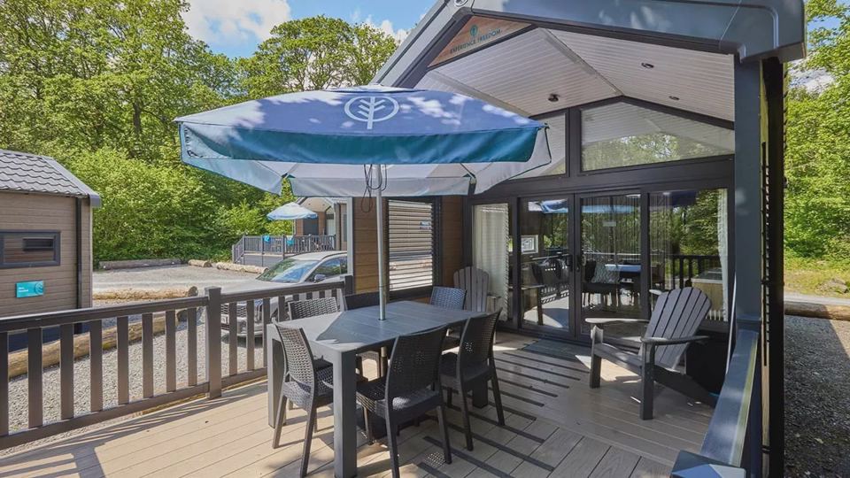 Lodge with decking and parasol