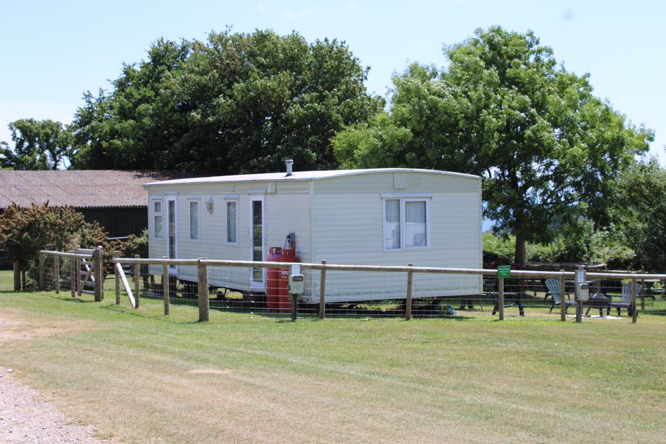Static caravan with picnic bench