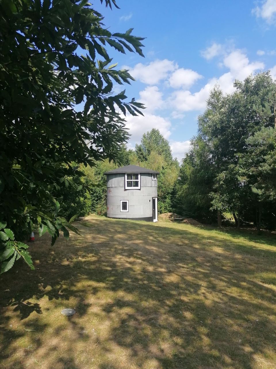 The silo among trees