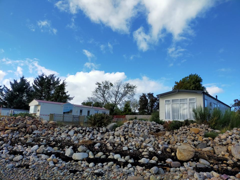 Caravans above the shingle shore