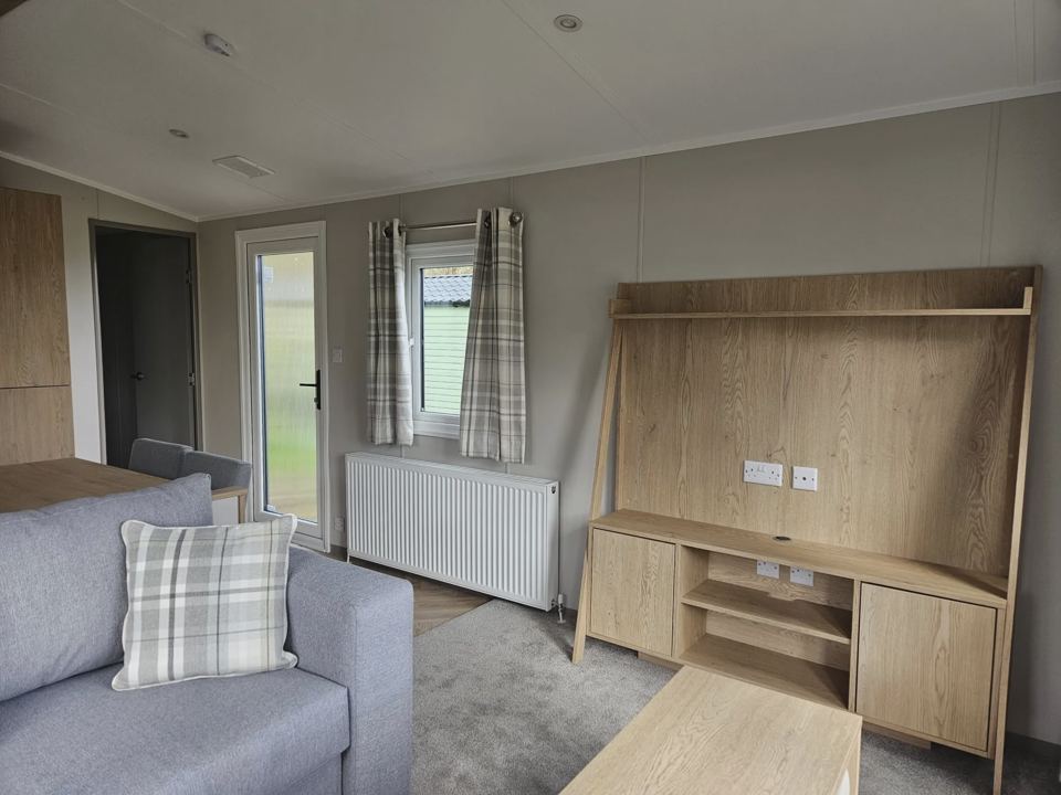 Lounge with fireplace and TV