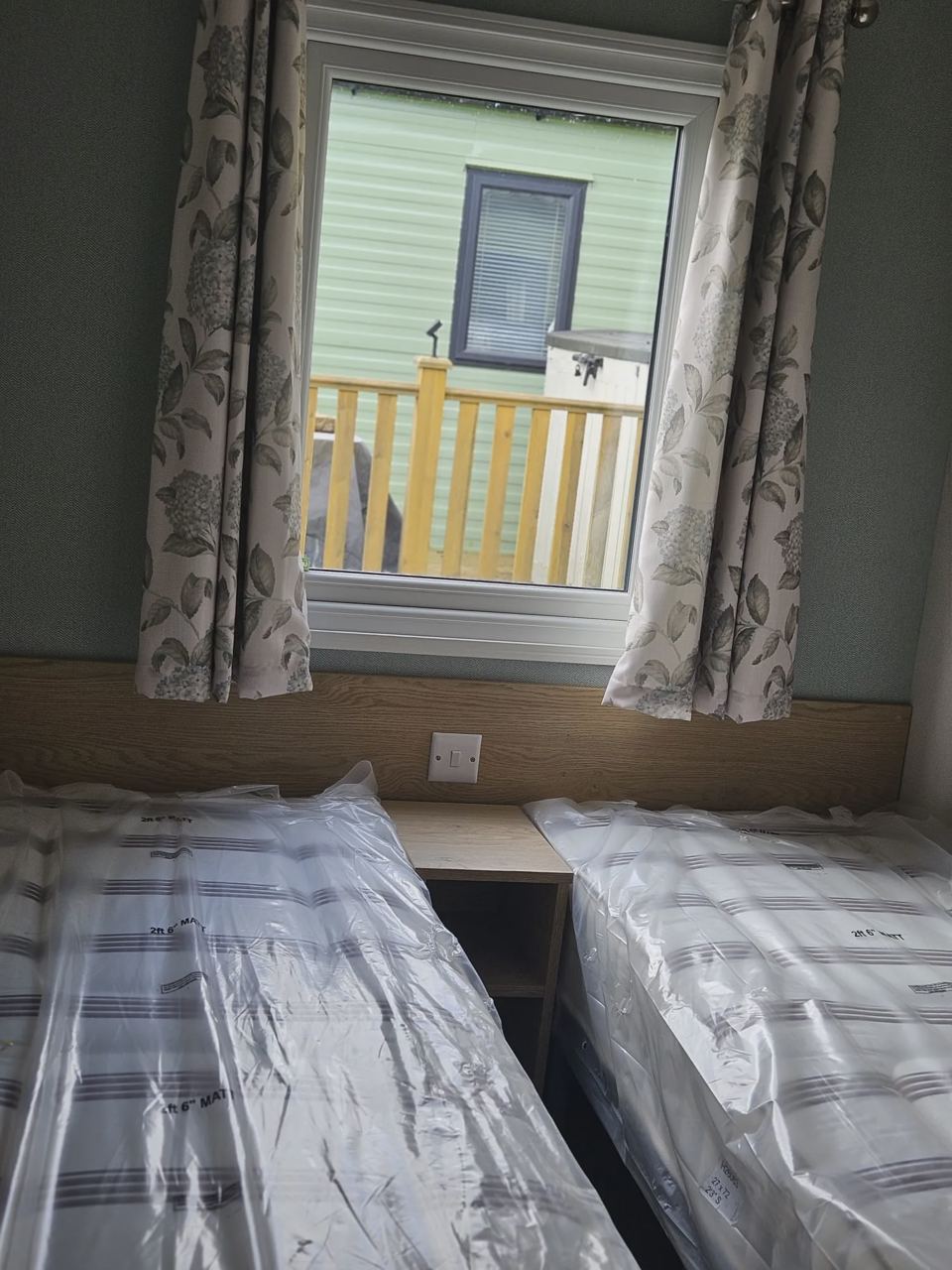 Twin bedroom with plaid curtains