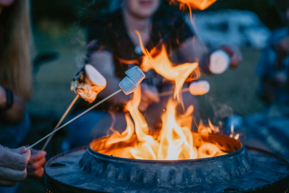 Toasting marshmallows on a fire pit