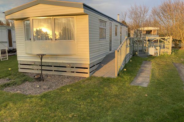 Static caravan on grass