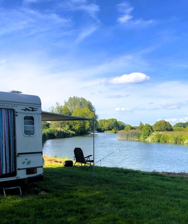 Caravan and awning by the river