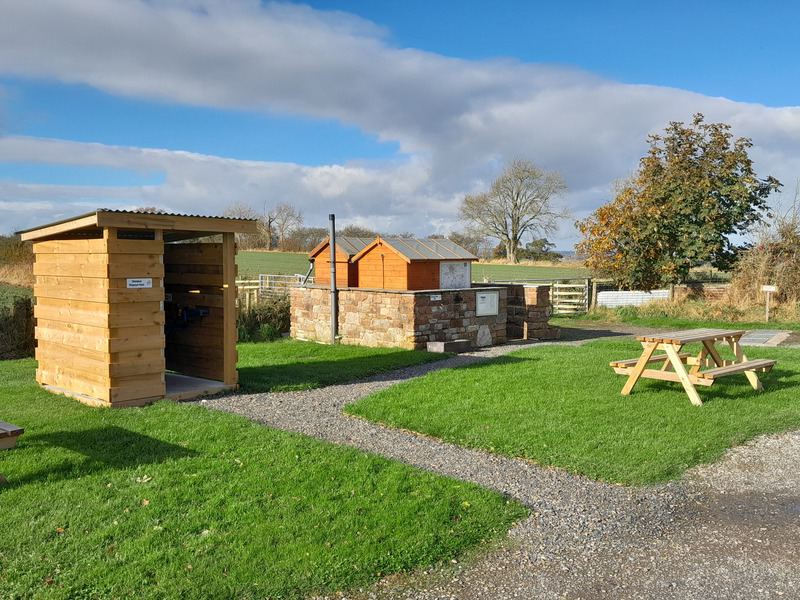 Toilet block and picnic table