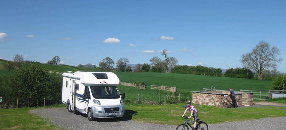 Motorhome beside the stone wall
