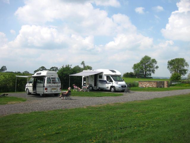 Motorhomes with awnings on gravel