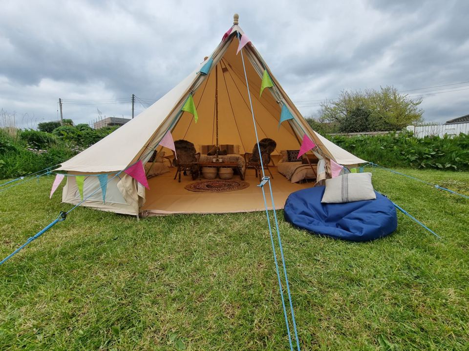 Bell tent with bunting and seating